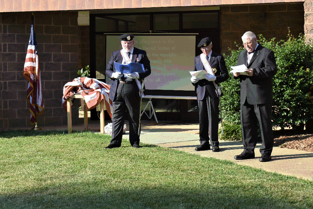 Worthy Navigator Eddie Williams, Sir Knight Bob Smith and Grand Knight George Brown officiating the Flag Retirement.